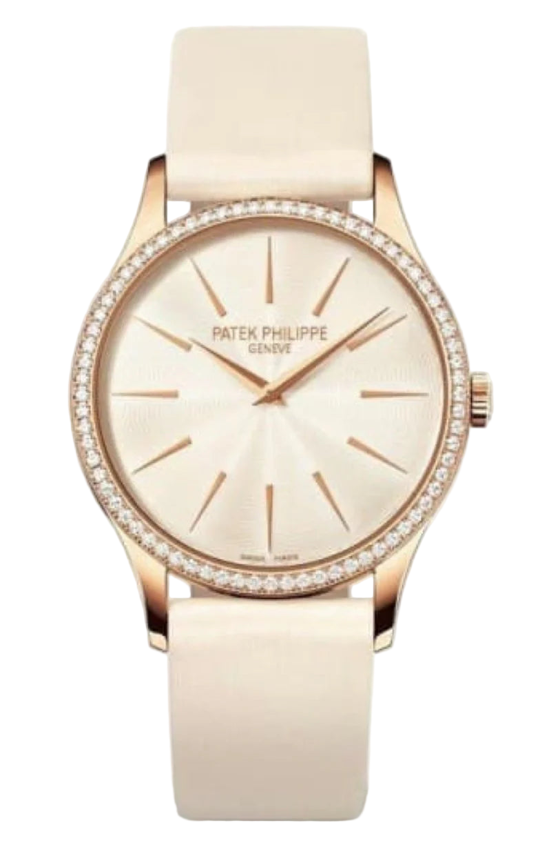Patek Philippe watch with beige strap and face on a white background
