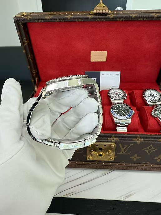 Rolex GMT-Master II "The Batman" with reference number 126710BLNR in it's box. Dial and face shown, as well as official Rolex box and documents.