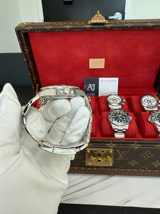 Rolex GMT-Master II "The Batman" with reference number 126710BLNR in it's box. Dial and face shown, as well as official Rolex box and documents.