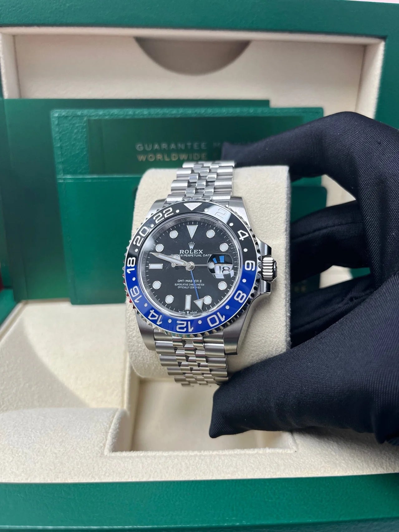 Rolex GMT-Master II "The Batman" with reference number 126710BLNR in it's box. Dial and face shown, as well as official Rolex box and documents.